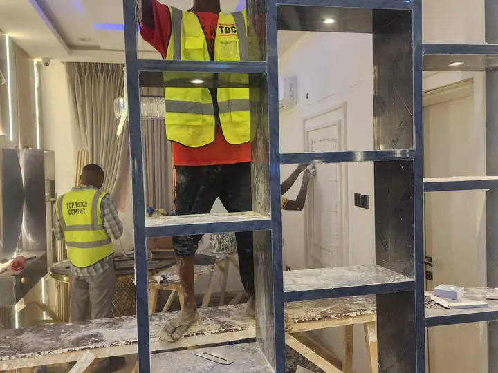 Installation team completing detailed interior work
