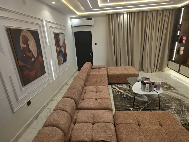 Finished living room with ceiling lighting and furniture setup